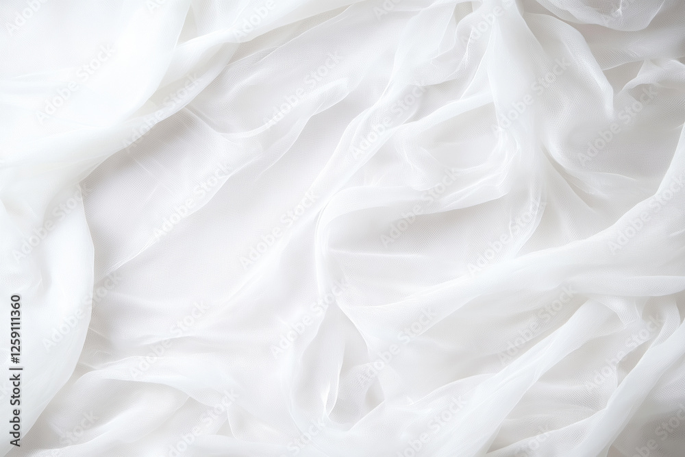 Obraz premium Soft white fabric draping elegantly across a surface in natural light