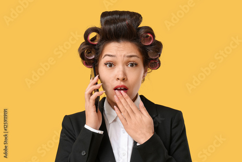 Shocked Asian businesswoman...