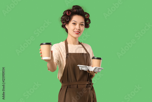 Female Asian barista with h...