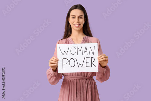 Young woman with placard on...