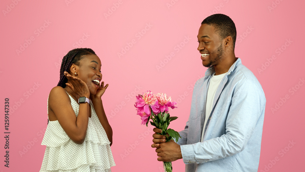 Making Surprise. Excited black girlfriend receiving bouquet of flowers from happy boyfriend, guy holding gift greeting lady with St Valentine's or International Women's Day, 8 March, Birthday Party Making Surprise. Excited black girlfriend receiving bouquet of flowers from happy boyfriend, guy holding gift greeting lady with St Valentine's or International Women's Day, 8 March, Birthday Party