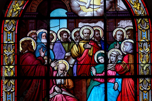 Stained glass (19th century) of Pentecost Sunday: The Holy Spirit Comes and descending on disciples as Tongues of Fire. .