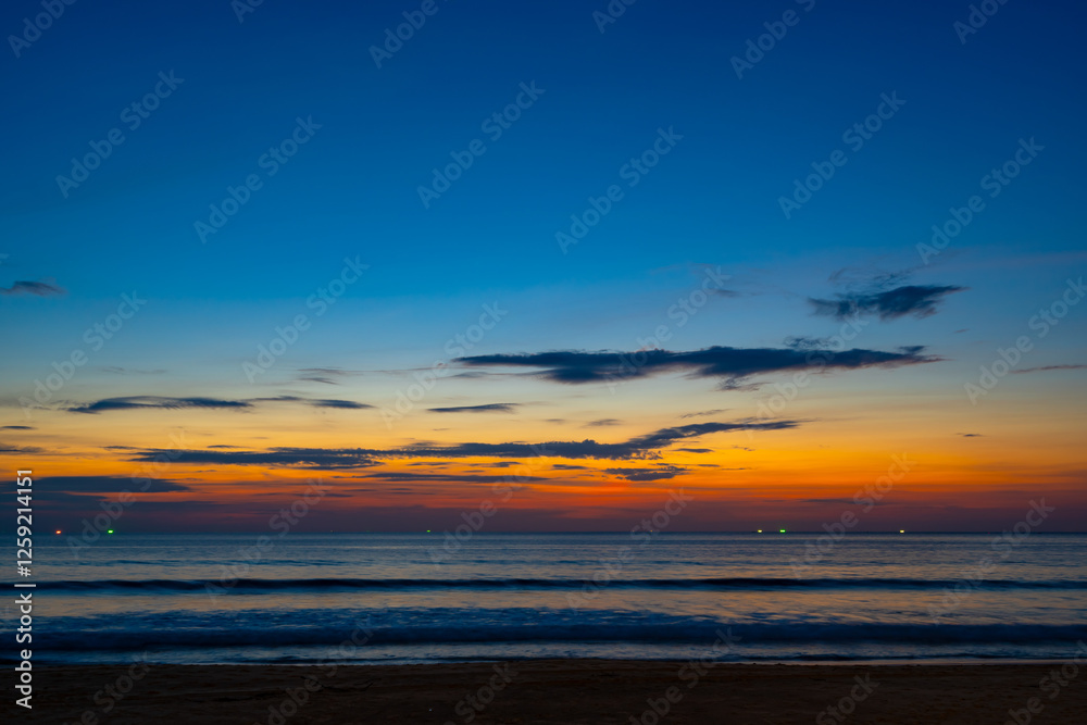 Fototapeta premium Landscape of colorful clouds in sunset or sunrise sky over sea with reflection in the tropical sea,Beautiful seascape scenery,Amazing light of nature Landscape nature background