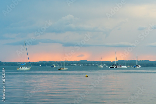 Wallpaper Mural Boats moored between Coochiemudlo Island and Victoria Point viewed at dusk, beneath an overcast sky. Queensland, Australia  Torontodigital.ca