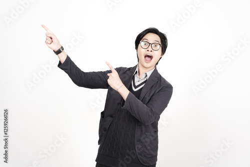 Photography Shocked wow face Presenting and pointing up with forefinger on copyspace for adv