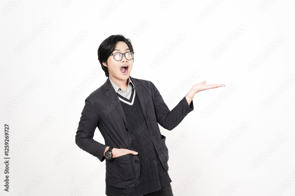 Shocked face Showing and Presenting Product on Open Palm Of Handsome Asian Man Isolated On White Background Shocked face Showing and Presenting Product on Open Palm Of Handsome Asian Man Isolated On White Background