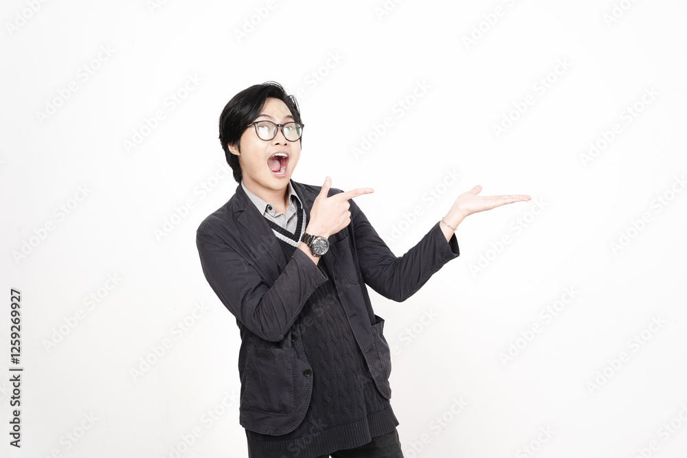 Shocked face Showing and Presenting Product on Open Palm Of Handsome Asian Man Isolated On White Background Shocked face Showing and Presenting Product on Open Palm Of Handsome Asian Man Isolated On White Background