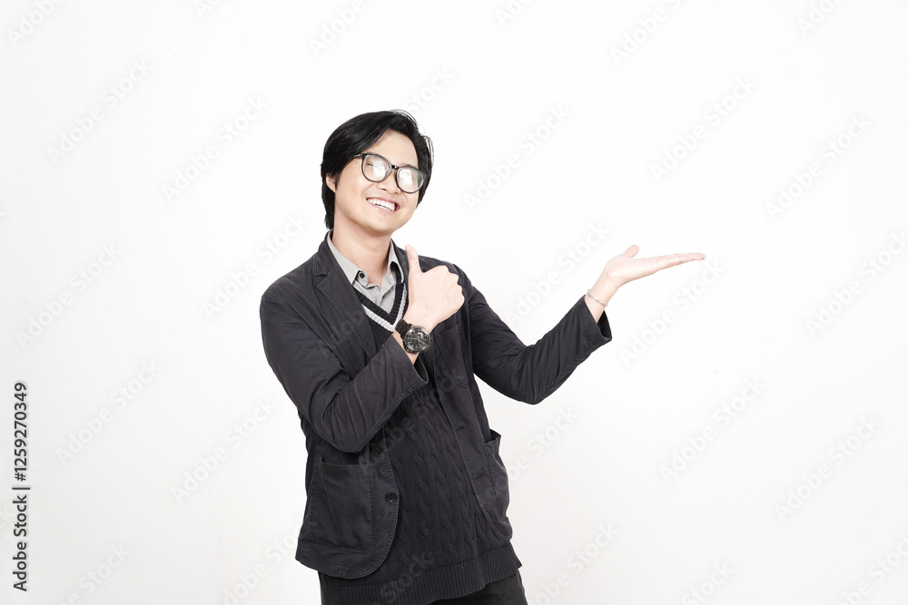 Smiling Showing and Presenting Product on Open Palm with Thumbs up Of Handsome Asian Man Isolated On White Background Smiling Showing and Presenting Product on Open Palm with Thumbs up Of Handsome Asian Man Isolated On White Background