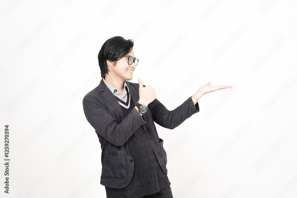 Smiling Showing and Presenting Product on Open Palm with Thumbs up Of Handsome Asian Man Isolated On White Background Smiling Showing and Presenting Product on Open Palm with Thumbs up Of Handsome Asian Man Isolated On White Background