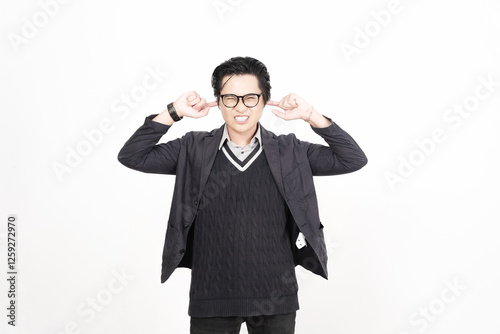 Covering ears from bothering noise Of Handsome Asian Man Isolated On White Background photo