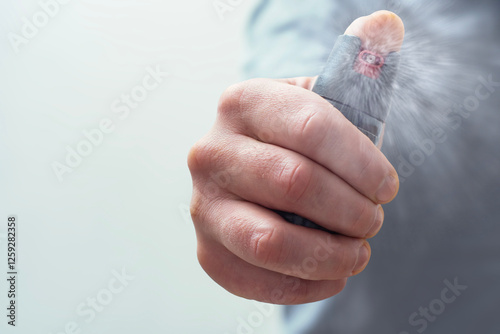 Close-Up of hand holding pepper spray, self-defense and security concept. photo