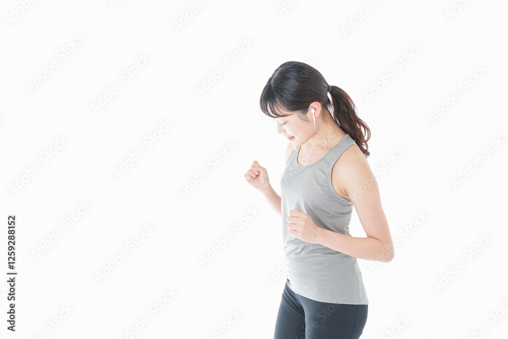 ランニングをする若い女性 ランニングをする若い女性