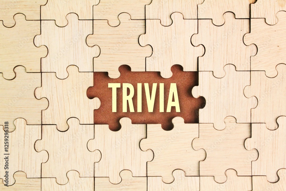 wooden puzzle with trivia words. details of information of little importance or value. wooden puzzle with trivia words. details of information of little importance or value.