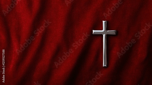 Polished Cross on Deep Red Cloth Backdrop Symbol of Faith and Christianity Emblem of Spiritual Beliefs photo