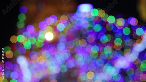 blur colors of fluorescent light colorful in dark for festival temple fair background.