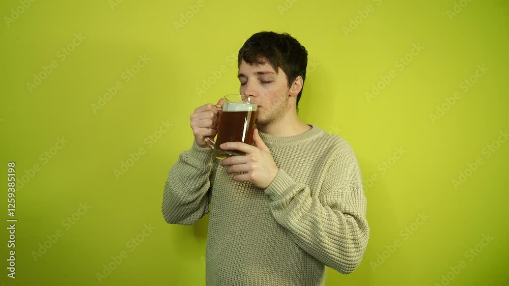 Young attractive man drinking beer. Young attractive man drinking beer.