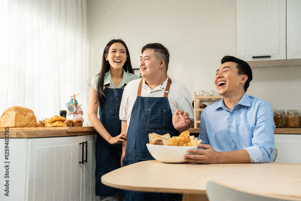 Asian happy family, mature parents baking bakery with son in kitchen. Asian happy family, mature parents baking bakery with son in kitchen.