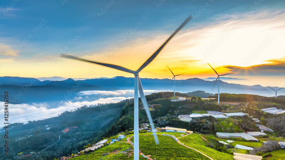 Aerial view dawn on the Da Lat plateau, Vietnam. Below are tea hills and wind turbines, a peaceful land for weekend travel