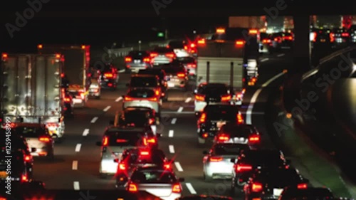 A video of taillights moving slowly due to Traffic Jam, Urban Night Scene	
