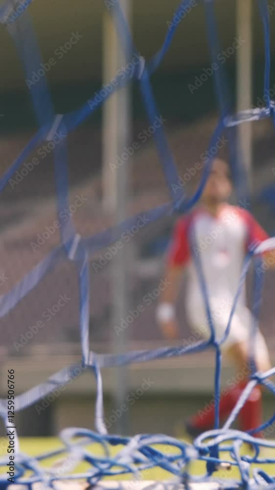 Football player scoring a goal Football player scoring a goal