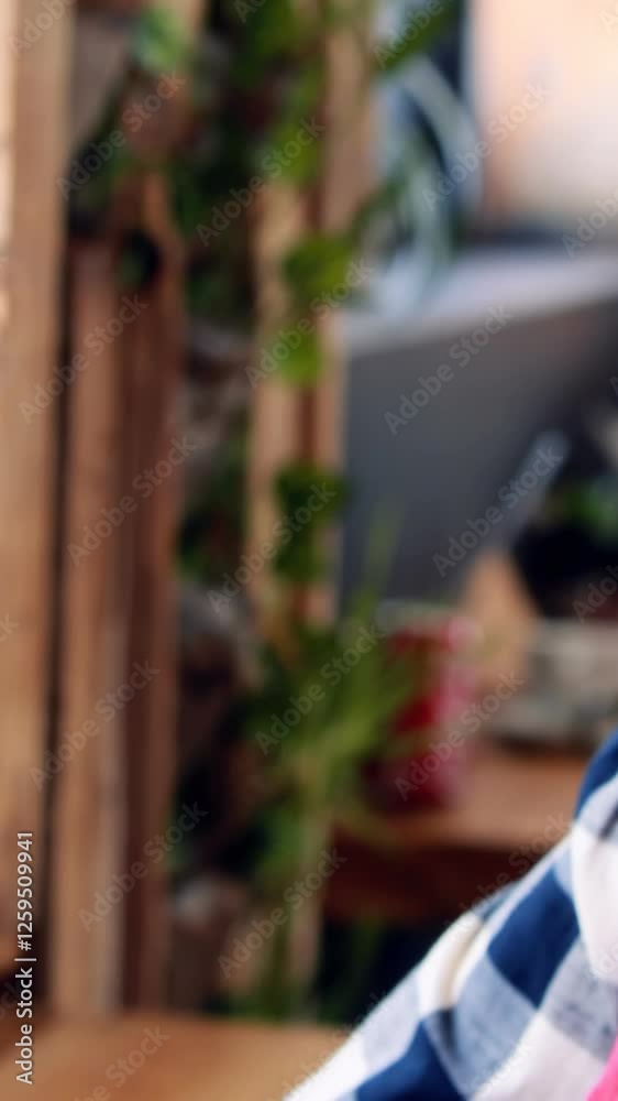 Woman using tablet and looking at window Woman using tablet and looking at window