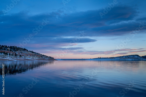 Fotografija winter dusk over calm Carter Lake in northern Colorado at foothills of Rocky Mou