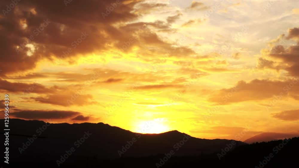 Timelapse shot of the movement of the sun and clouds at sunset. Autumn golden sky at magic hour. 4K Timelapse shot of the movement of the sun and clouds at sunset. Autumn golden sky at magic hour. 4K