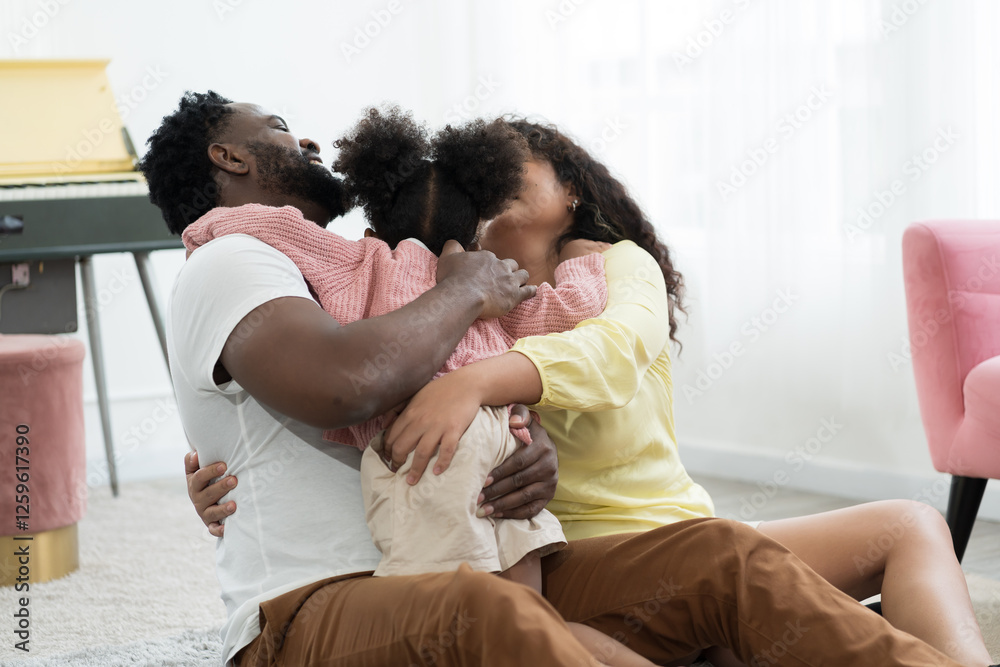 Happy diverse family concept. African American father, mother and cute daughter playing together at home. Small family spending time together at home. Father, mother, daughter and family concept Happy diverse family concept. African American father, mother and cute daughter playing together at home. Small family spending time together at home. Father, mother, daughter and family concept