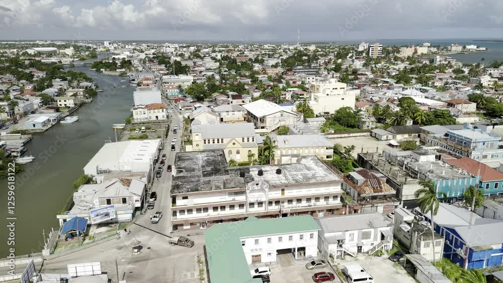 Drone flies to the right from Haulover Creek over the Swing Bridge on a sunny morning in Belize City Drone flies to the right from Haulover Creek over the Swing Bridge on a sunny morning in Belize City