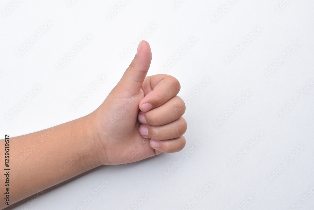 Child hand gesture giving thumbs up, like.Isolated on white background. Design elements. Concept of success or victory Child hand gesture giving thumbs up, like.Isolated on white background. Design elements. Concept of success or victory