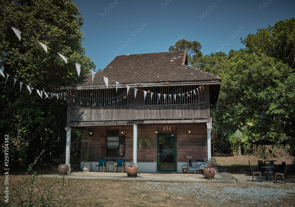 Malay-style timber house, Malay kampung wooden house, featuring Malay heirlooms. Malay-style timber house, Malay kampung wooden house, featuring Malay heirlooms.