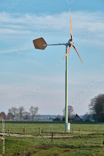 Small Wind Turbine in Rural Landscape with Green Energy Focus photo