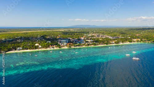 Beautiful Alona beach and blue sea in Panglao island, Bohol, Philippines. Holiday and vacation concept. Tropical beach.