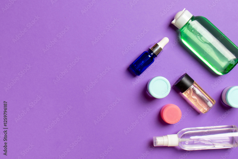 Cosmetics SPA branding mock-up, top view with copy space. set of tubes and jars of cream flat lay on colored background Cosmetics SPA branding mock-up, top view with copy space. set of tubes and jars of cream flat lay on colored background