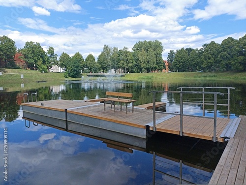 wooden pier on the calm surface of the lake
