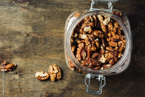 Shelled walnuts in jar.