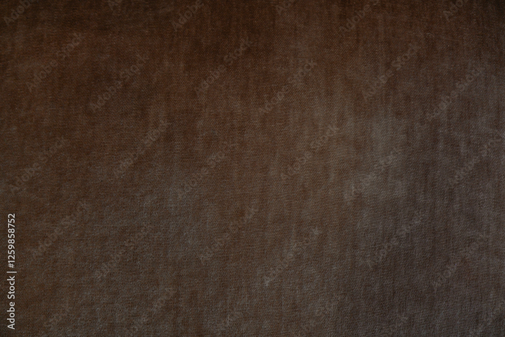 Subtle texture of dark brown fabric highlighting its soft appearance and quality Subtle texture of dark brown fabric highlighting its soft appearance and quality