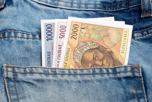 Old Central African CFA franc  in the pocket of blue jeans