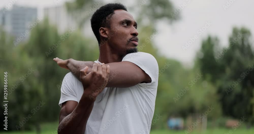 African american man warm up and strech in the park outdoors for a workout. Male prepared to running in the park. Healthy, exercise, fitness and lifestyle concept. African american man warm up and strech in the park outdoors for a workout. Male prepared to running in the park. Healthy, exercise, fitness and lifestyle concept.