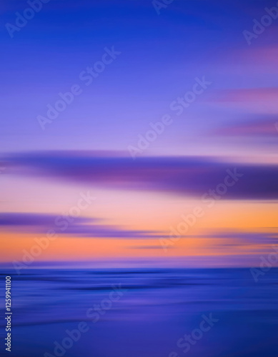 An abstract nature background showcasing the serene blend of blue, purple, and orange hues in a dreamy seascape.