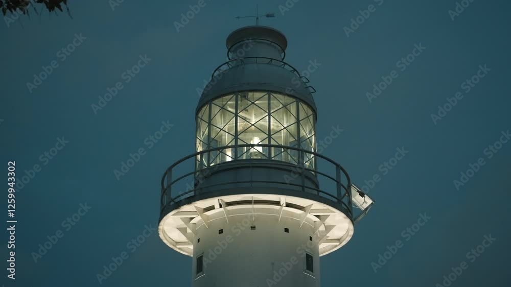 Fort Canning Lighthouse in Singapore standing against the twilight sky. Fort Canning Lighthouse in Singapore standing against the twilight sky.