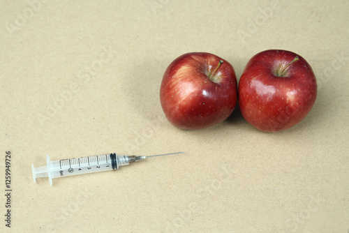 syringe fruit of red apple. healthy food containing mineral and vitamin c