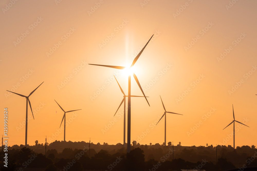 View of wind turbine against sunset sky which can turns wind energy into electricity View of wind turbine against sunset sky which can turns wind energy into electricity