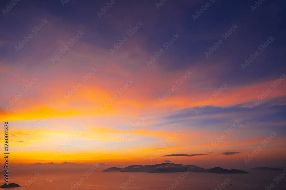 Fototapeta premium sunset cloudscape Panoramic with rich purple and pink tones blending into orange at horizon, twilight backdrop