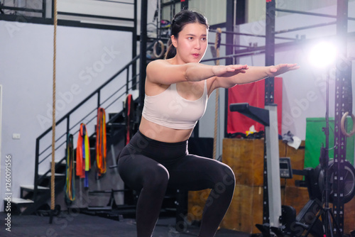 Asian women exercising in the gym. Healthy exercise concept.