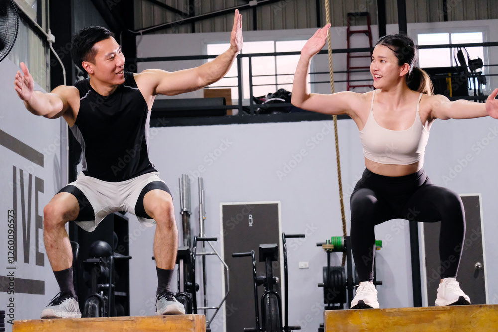 Fototapeta premium Young men and women working out for health in the gym.