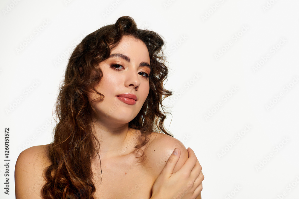 Fototapeta premium Stylish young woman posing with confidence in a creative studio setting