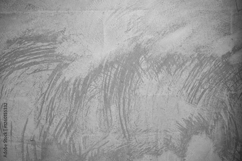 Fototapeta premium Textured gray surface with abstract patterns and brush strokes