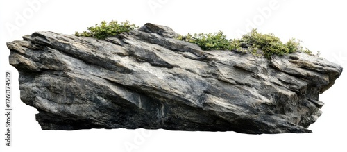 Large rock cliff with textured gray surface and green moss on top, positioned centrally against a clean white background for isolation. photo