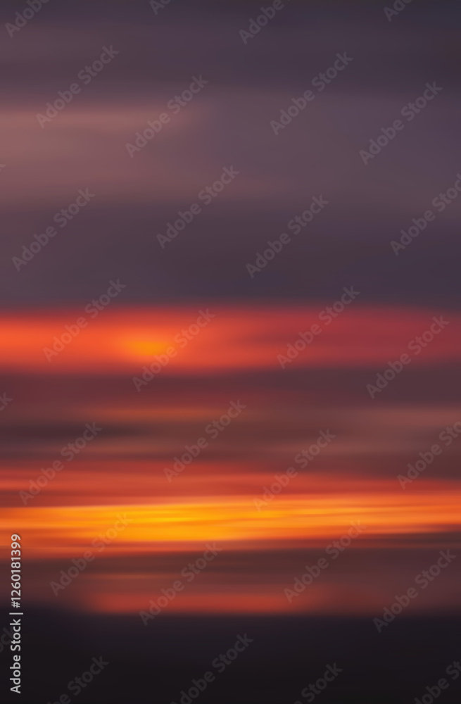 Fototapeta premium Abstract blurred background of a vibrant sunset over natural landscape with soft colors